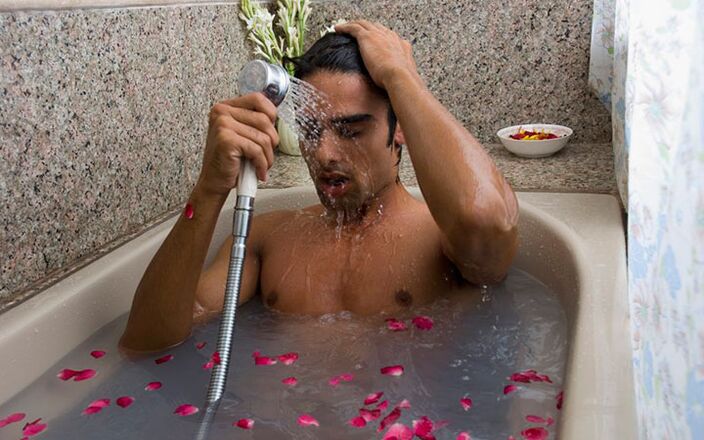 A man takes a contrast bath to increase his potency